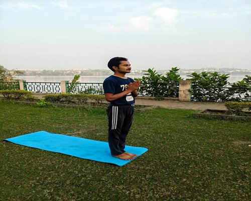 Person practicing morning yoga and healthy lifestyle routine